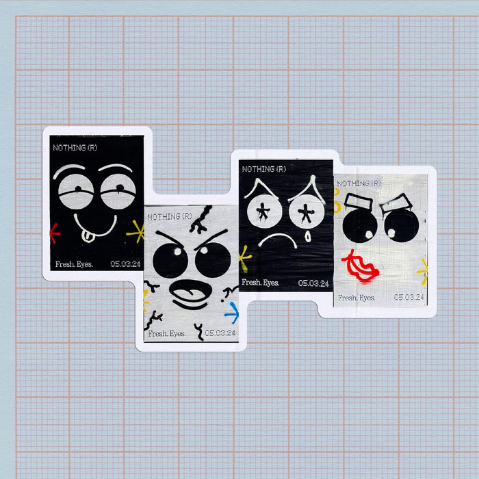 a group of cards with faces on a graph paper