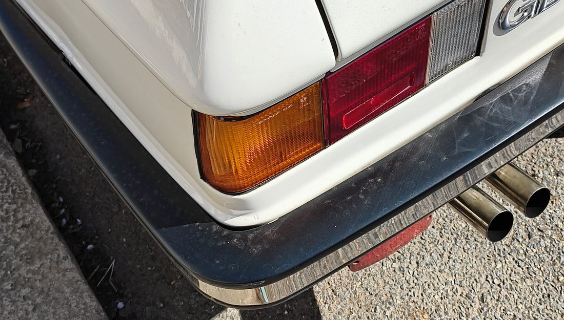 the back end of a white car