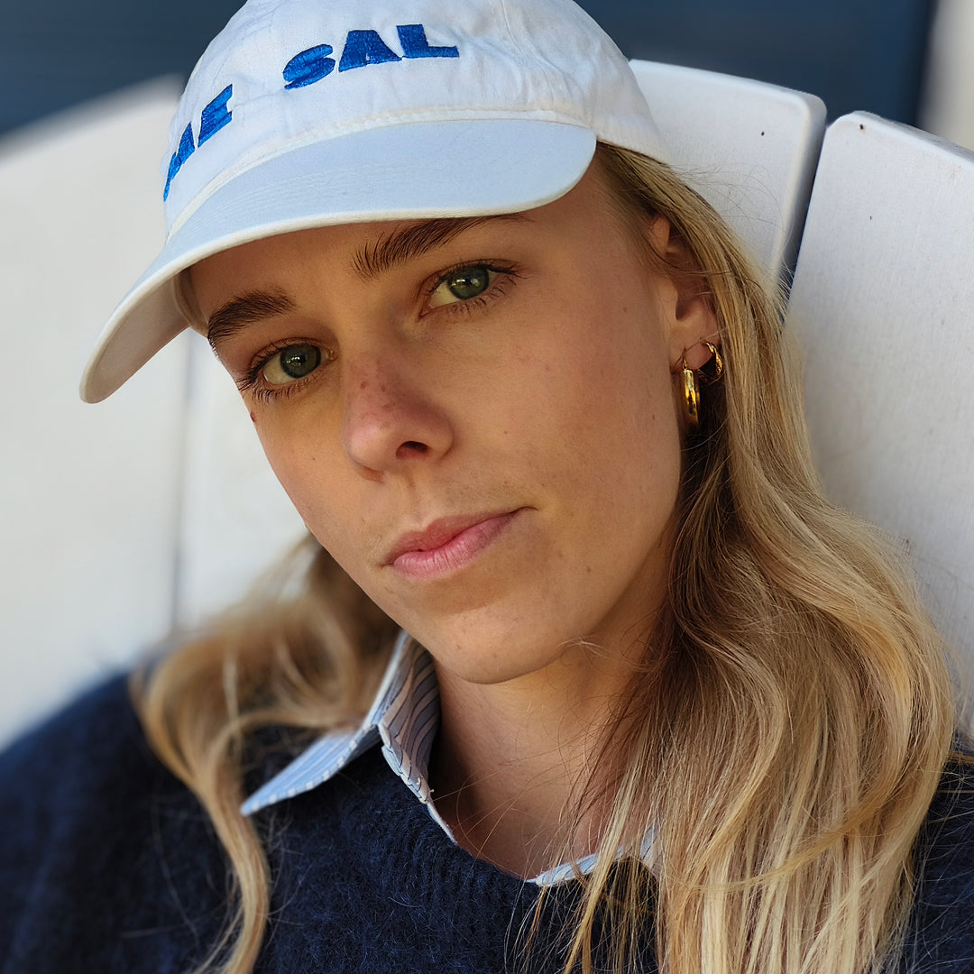 a woman wearing a white hat