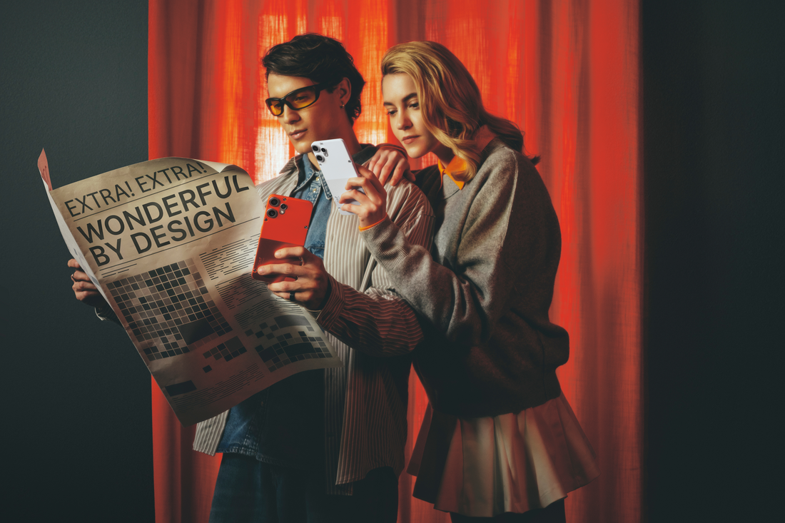 a man and woman looking at a newspaper